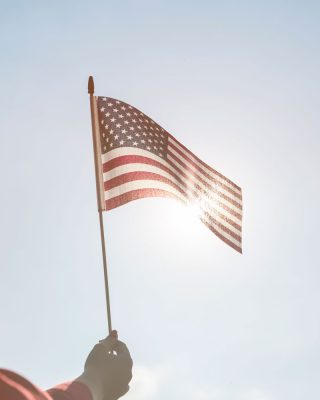 raising-american-flag-bright-sun